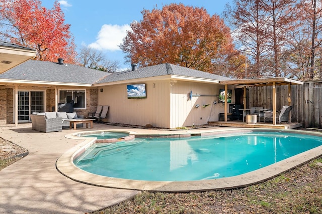 view of swimming pool featuring an in ground hot tub, an outdoor living space, and a patio area