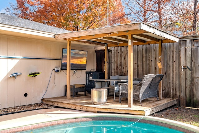 view of pool featuring an outdoor living space and a deck