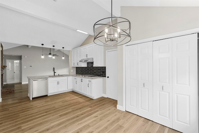 kitchen with sink, hanging light fixtures, stainless steel appliances, decorative backsplash, and white cabinets