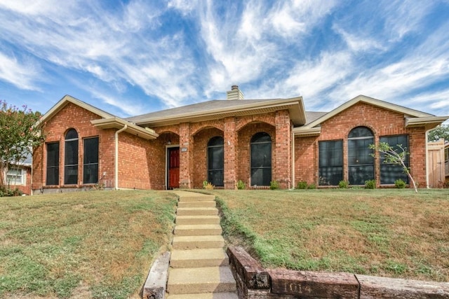 ranch-style home with a front yard