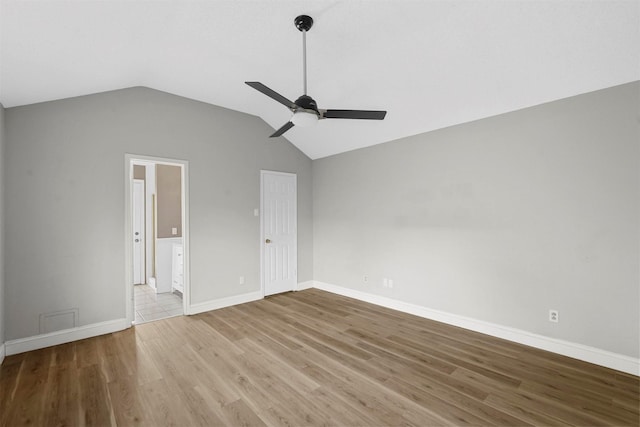 unfurnished bedroom with ceiling fan, light hardwood / wood-style flooring, and vaulted ceiling