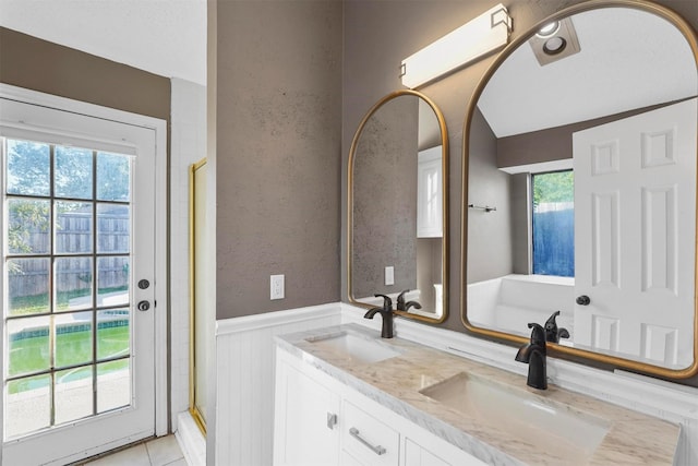 bathroom featuring tile patterned floors, plenty of natural light, vanity, and an enclosed shower