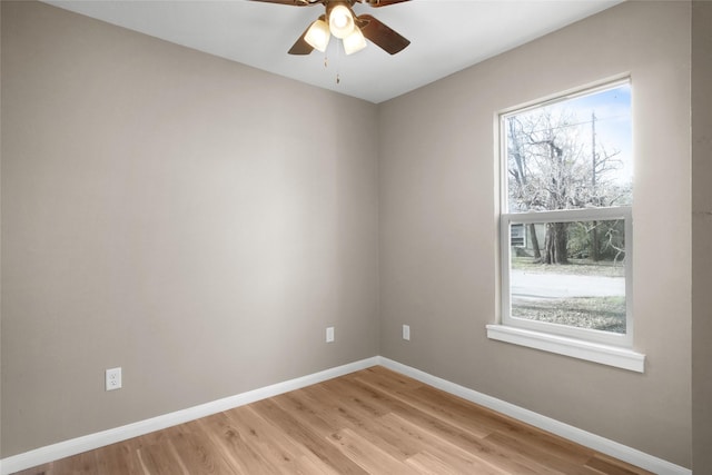 unfurnished room with ceiling fan, plenty of natural light, and light hardwood / wood-style flooring