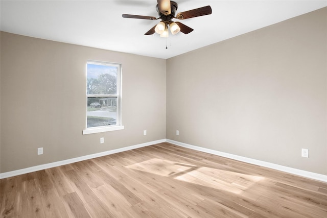 spare room featuring ceiling fan and light hardwood / wood-style flooring