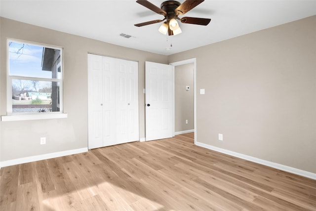 unfurnished bedroom with light hardwood / wood-style flooring and ceiling fan