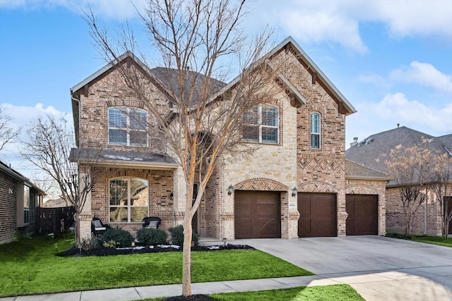 front facade featuring a garage and a front lawn