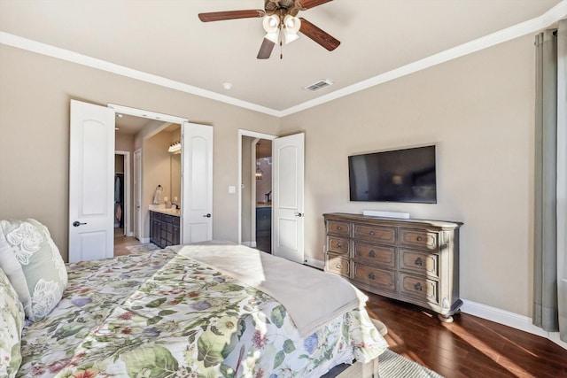 bedroom with ensuite bath, ceiling fan, dark wood-type flooring, and crown molding