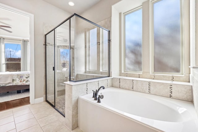 bathroom featuring tile patterned floors and independent shower and bath