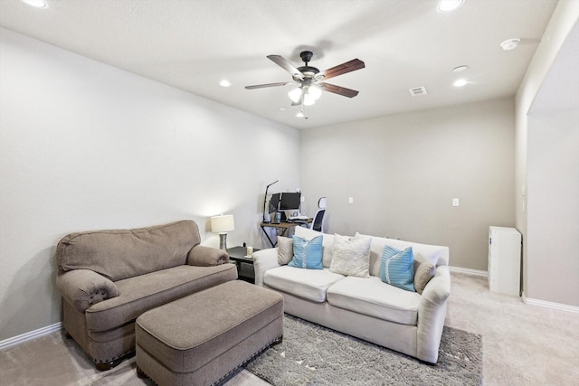 carpeted living room featuring ceiling fan