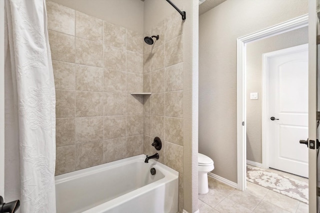 bathroom with tile patterned flooring, shower / bathtub combination with curtain, and toilet