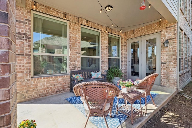 view of patio featuring an outdoor living space and french doors