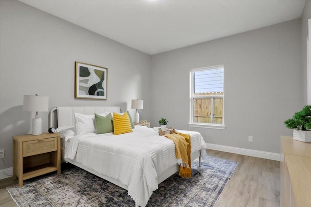 bedroom with light hardwood / wood-style flooring