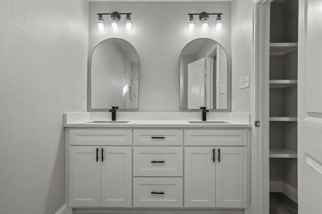 bathroom featuring built in features and vanity