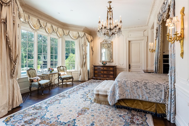 bedroom featuring crown molding, dark hardwood / wood-style flooring, and a notable chandelier