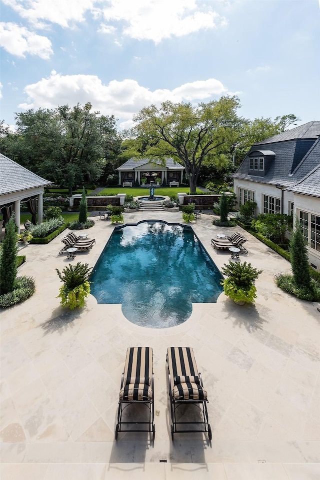 view of pool with a gazebo and a patio area