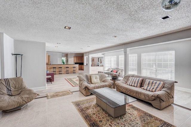 living room featuring a textured ceiling