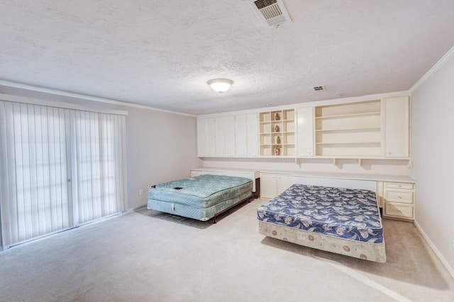 carpeted bedroom featuring a textured ceiling and ornamental molding