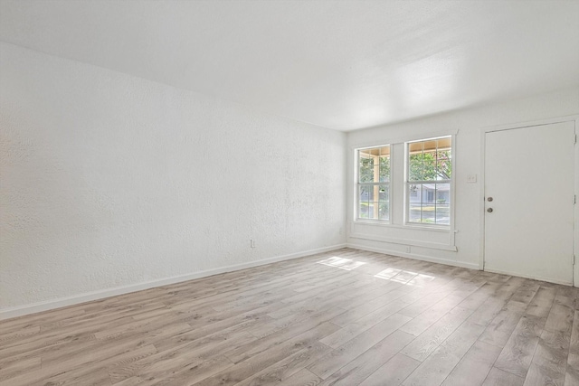 empty room featuring light hardwood / wood-style floors