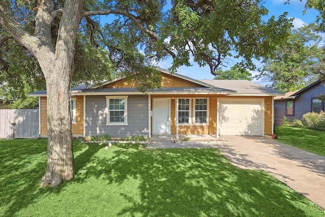 single story home with a front yard and a garage