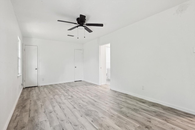 unfurnished room featuring light hardwood / wood-style floors and ceiling fan