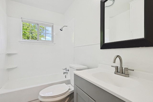 full bathroom featuring tiled shower / bath, vanity, and toilet