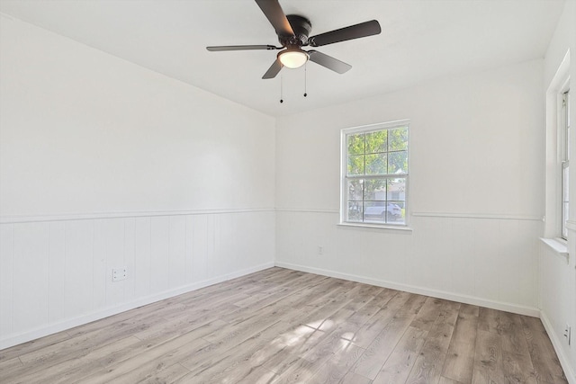 spare room featuring ceiling fan and light wood-type flooring