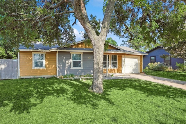 ranch-style house with a front lawn and a garage