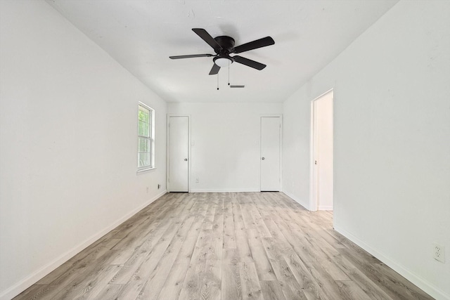 unfurnished room with ceiling fan and light hardwood / wood-style flooring