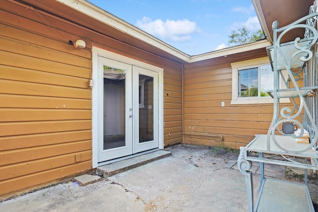 property entrance featuring french doors and a patio