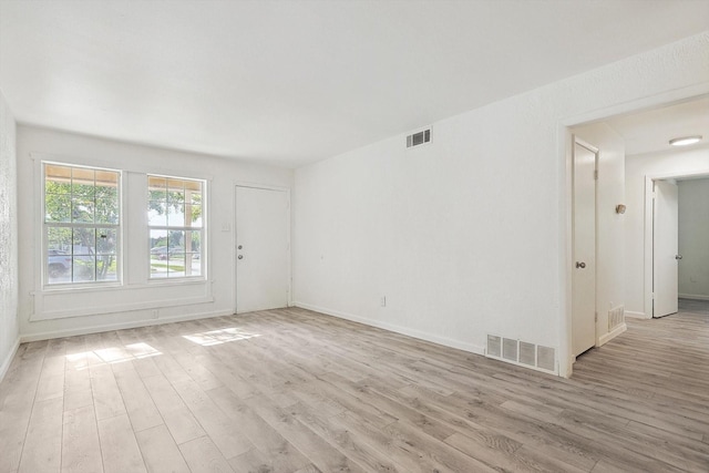 unfurnished room featuring light hardwood / wood-style flooring