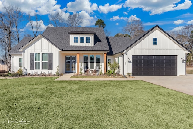 modern farmhouse featuring french doors, a front lawn, and a garage