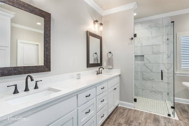 bathroom with vanity, wood-type flooring, an enclosed shower, and ornamental molding