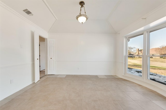 unfurnished room with ornamental molding, vaulted ceiling, and light tile patterned floors