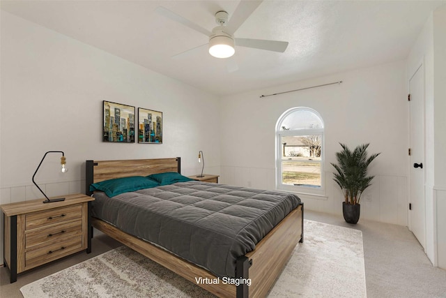 bedroom with light carpet and ceiling fan