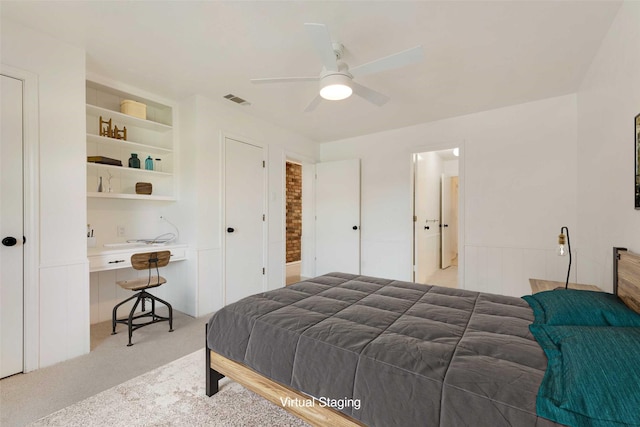 bedroom featuring ceiling fan and light carpet