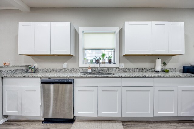 625 S Montgomery St, Sherman, TX 75090 - kitchen with dishwasher, a sink, light wood-type flooring, light stone counters, and white cabinetry