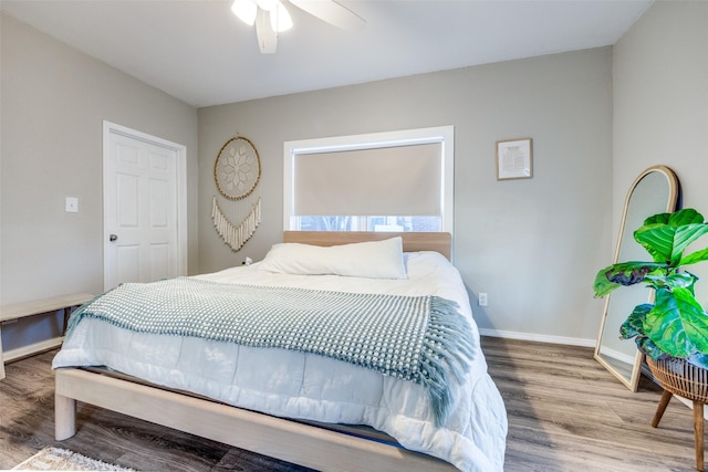 bedroom featuring ceiling fan and hardwood / wood-style floors