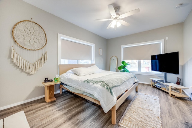 bedroom featuring ceiling fan and hardwood / wood-style floors