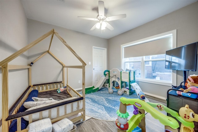 bedroom with ceiling fan and wood-type flooring