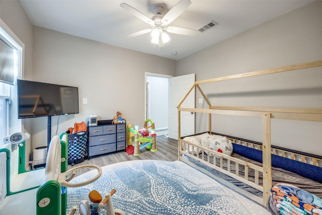 bedroom with ceiling fan and light hardwood / wood-style floors