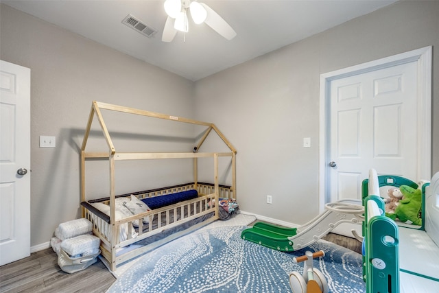 625 S Montgomery St, Sherman, TX 75090 - bedroom with wood finished floors, baseboards, and ceiling fan