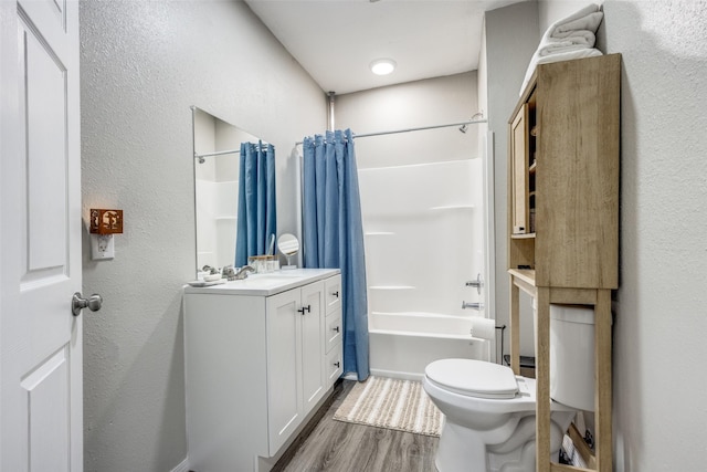 full bathroom featuring toilet, shower / tub combo, vanity, and hardwood / wood-style floors