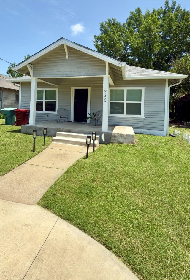 625 S Montgomery St, Sherman, TX 75090 - view of front of house featuring a porch and a front lawn