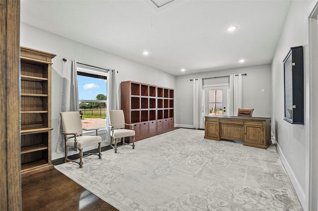 living area with concrete flooring