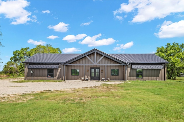 rear view of property with a yard