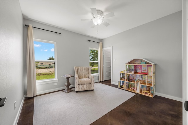 living area featuring ceiling fan