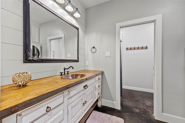 bathroom with vanity and concrete floors