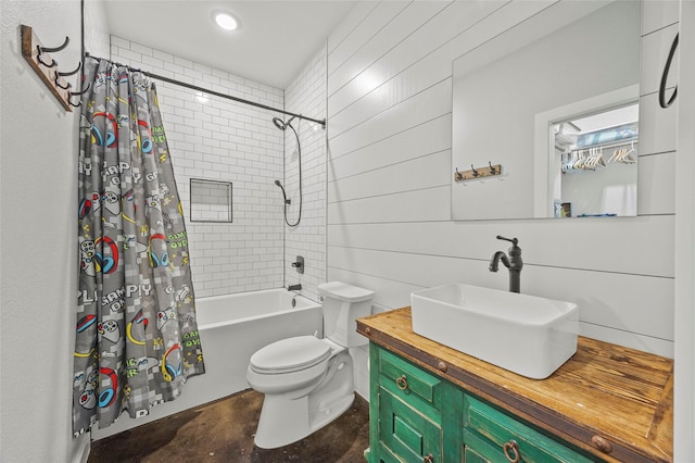 full bathroom featuring vanity, concrete floors, shower / bath combo with shower curtain, and wood walls