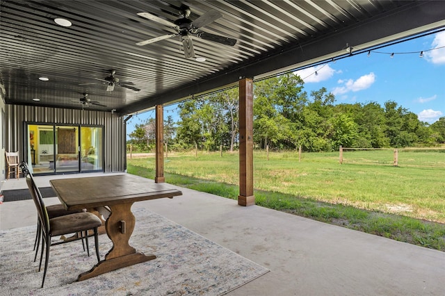 view of patio featuring ceiling fan