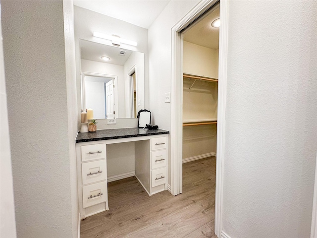 bathroom featuring wood-type flooring and vanity